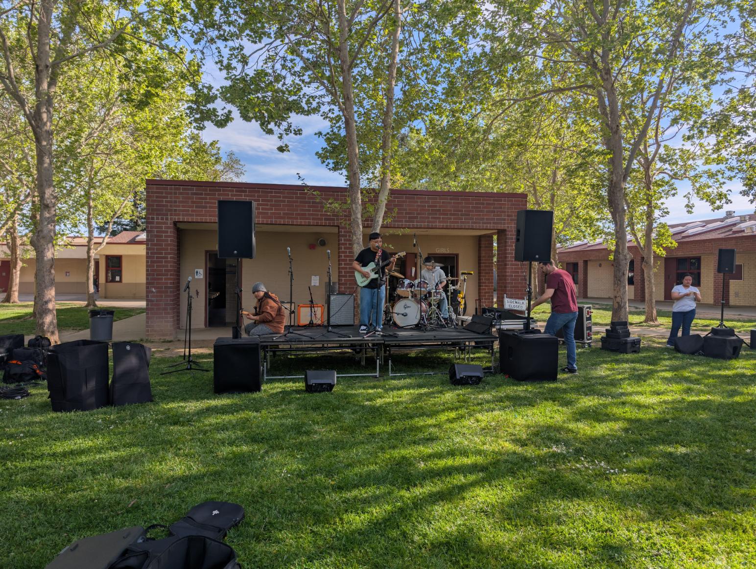Students running live sound reinforcement for an outdoor school concert